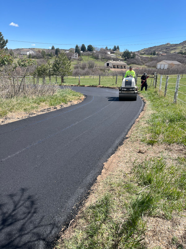 roller compacting fresh asphalt