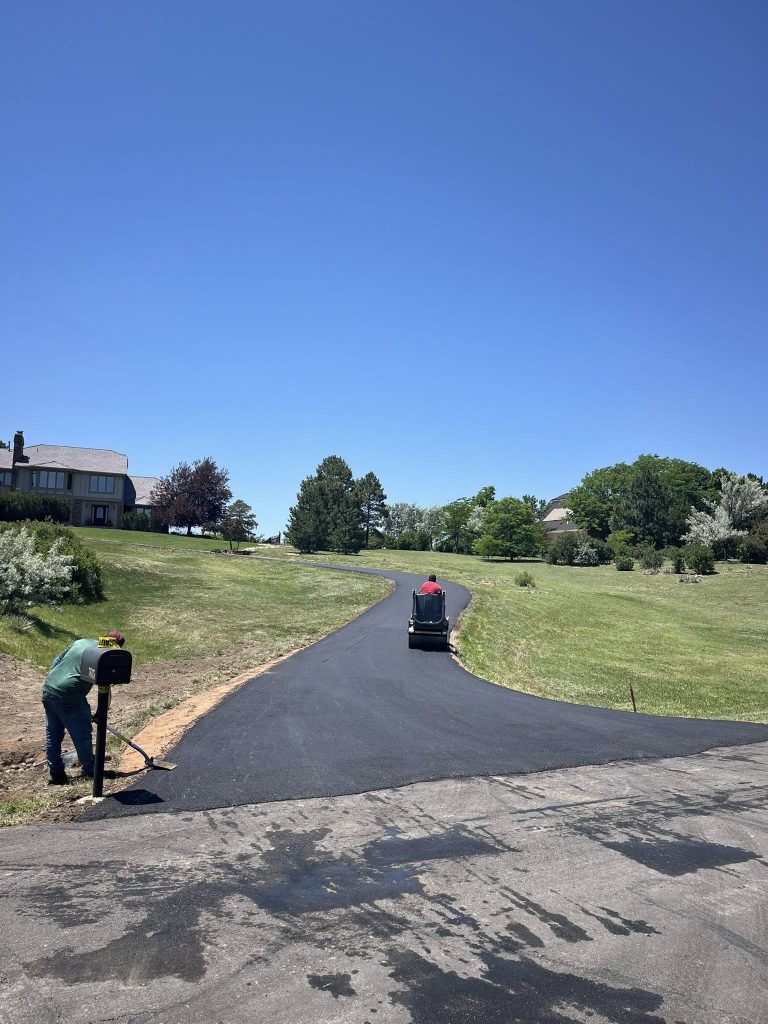 crew finishing installing a driveway
