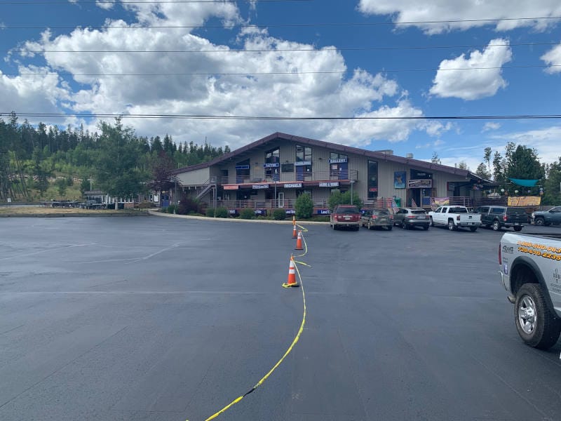 Parking lot taped off while seal coating dries