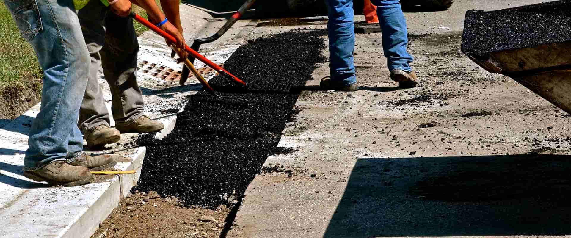 curb cut being patched with asphalt