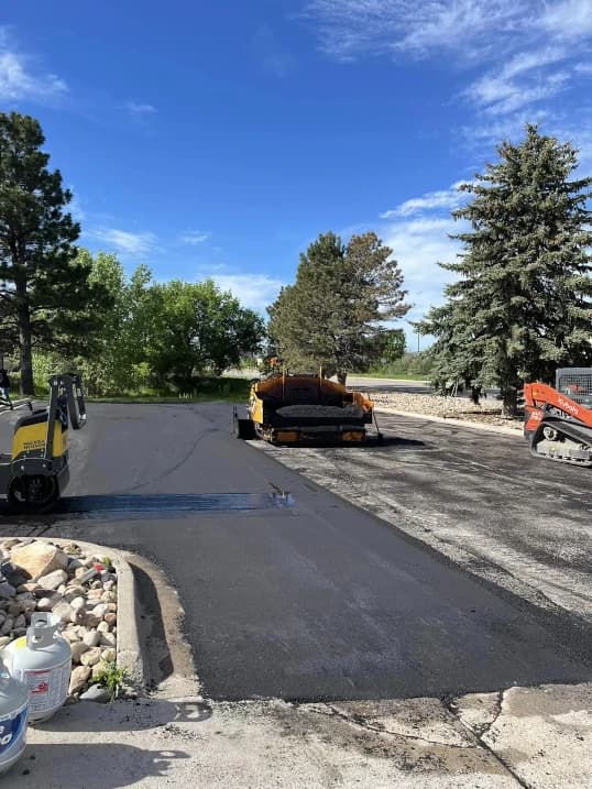 team laying asphalt