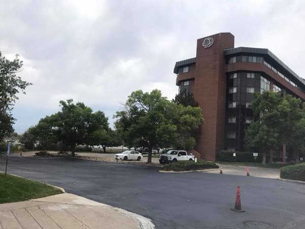 Hotel parking lot which has under gone asphalt maintenance including sealcoating, asphalt repair and striping.