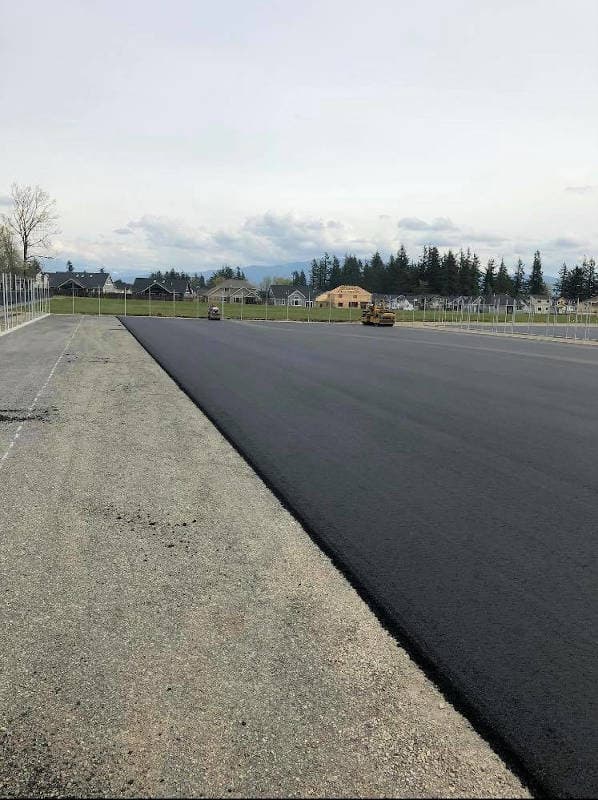 high school parking lot with an asphalt overlay