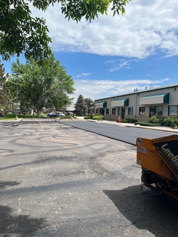 retail parking lot being paved with asphalt