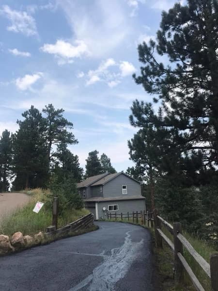new asphalt driveway installed at single family home