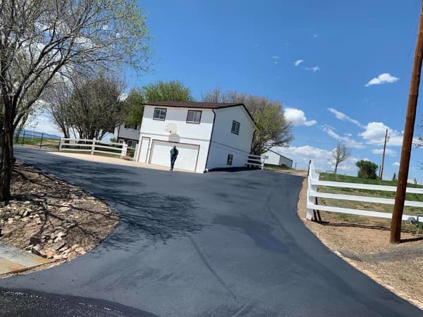 Single family driveway with new asphalt sealcoating